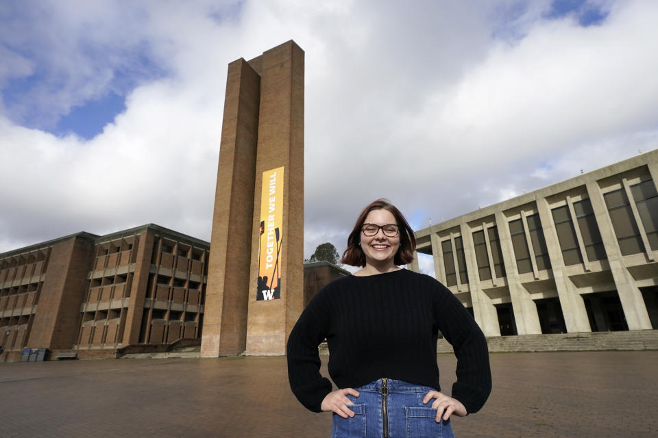 Sophie Corroon, a sophomore at the University of Washington, poses for a photo on the school's campus Monday, Jan. 25, 2021, in Seattle. Corroon helped work on proposed legislation in her home state of Utah to allow students to take mental health days to lessen stigma and help reduce youth suicide. Lawmakers in Utah and Arizona have proposed bills that would add "mental or behavioral" health to the list of excused absences for students. Similar legislation has passed in Oregon, Maine, Colorado and Virginia in the last two years. (AP Photo/Elaine Thompson)