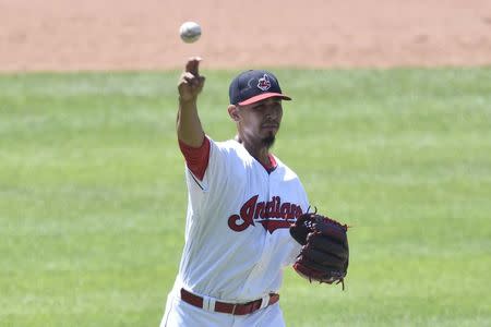 Jul 15, 2018; Cleveland, OH, USA; Cleveland Indians starting pitcher Carlos Carrasco (59) throws to first base after fielding a ground ball in the eighth inning against the New York Yankees at Progressive Field. Mandatory Credit: David Richard-USA TODAY Sports