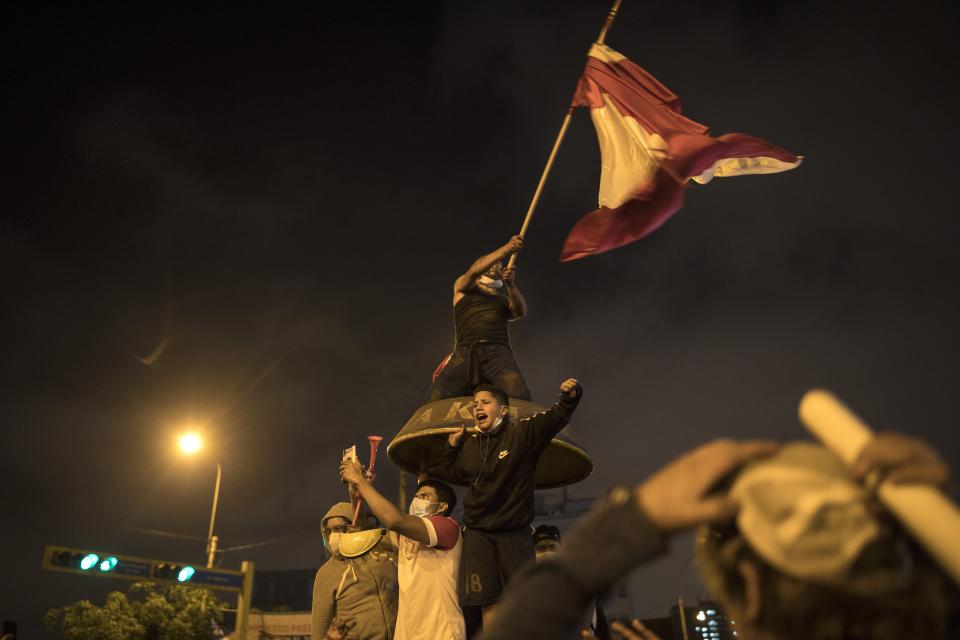 Demonstrators against the removal of President Martin Vizcarra gather during a protest in Lima, Peru, Thursday, Nov. 12, 2020. On Tuesday, Manuel Merino was sworn in as the country's president, after the legislature voted Vizcarra out of office Monday. (AP Photo/Rodrigo Abd)