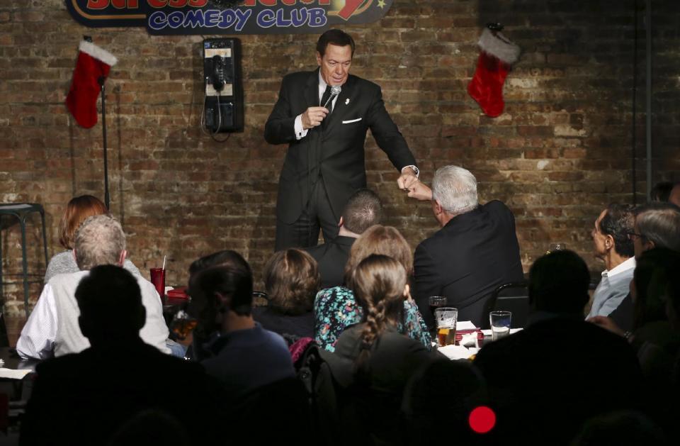 FILE - In this Wednesday, Dec. 7, 2016 file photo, actor, comedian and radio host Joe Piscopo greets a fan during a comedy event to help raise funds for the Boys and Girls Club of America at the Stress Factory Comedy Club in New Brunswick, N.J. Governor's races this year in Virginia and New Jersey are unfolding in ways strikingly similar to the turbulent 2016 presidential campaign. In New Jersey, the former "Saturday Night Live" comic and Trump supporter is considering a run for governor, possibly as an independent. (AP Photo/Mel Evans, File)