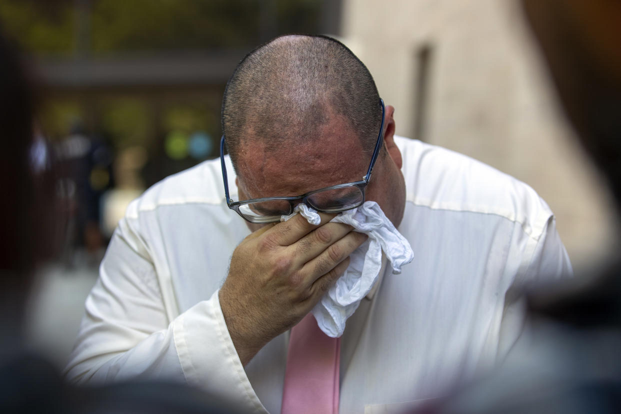 Paul Jamrowski, father of Jordan Anchondo and father in-law of Andre Anchondo, who both died in the El Paso Walmart mass shooting, breaks down in tears while speaking to the media outside the federal court in El Paso, Texas, Wednesday, July 5, 2023. Patrick Crusius, who is accused of killing nearly two dozen people in a racist attack at an El Paso Walmart in August 2019, is set to receive multiple life sentences after pleading guilty to federal hate crimes and weapons charges in one of the deadliest mass shootings in U.S. history. (AP Photo/Andrés Leighton)
