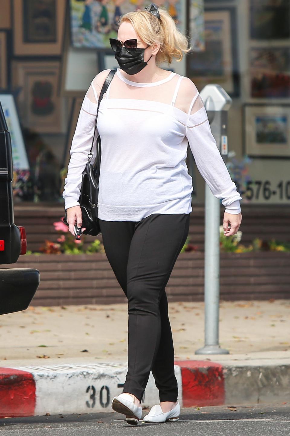 <p>Rebel Wilson is seen out and about in a black-and-white outfit on Tuesday in L.A. </p>