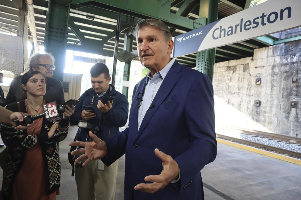 West Virginia Democratic Sen. Joe Manchin speaks with reporters outside the newly renovated Amtrak train station in Charleston, W.Va. on Thursday, Oct. 12, 2023 (AP Photo/Leah Willingham)