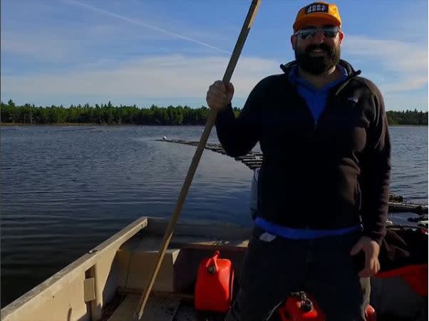 Maxime Daigle often takes to the cold waters off New Brunswick in one of his family's flat-bottomed boats to harvest oysters. (Photo: Karen Pinchin)