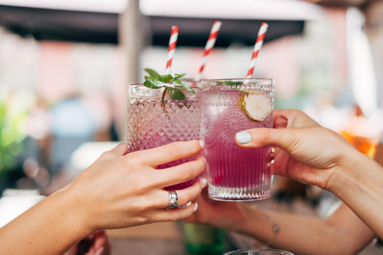 Three women making a celebratory toast