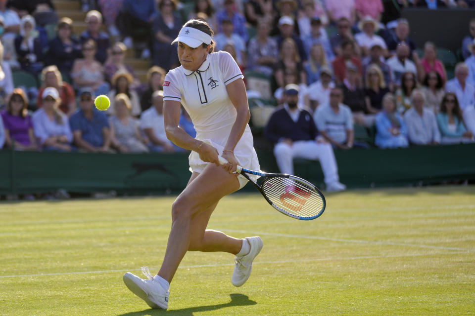 Australia's Ajla Tomljanovic returns the ball to France's Alize Cornet during a women's singles fourth round match on day eight of the Wimbledon tennis championships in London, Monday, July 4, 2022. (AP Photo/Kirsty Wigglesworth)