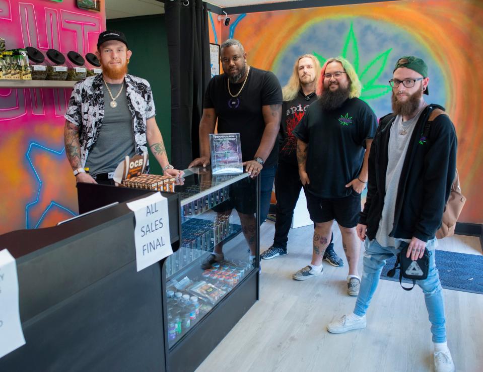 Cody Mathis, Frank Broughton, Casey Marler, Joe Rothstein and Aaron Crooke have opened the Green Light District, a new hemp dispensary in Warrington.
