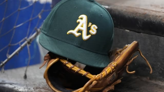 An Oakland Athletics hat and glove.