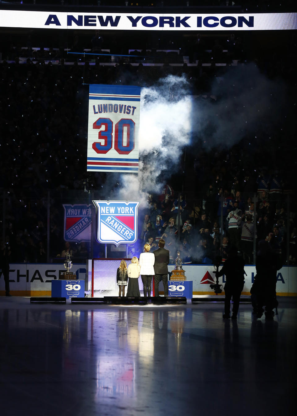 The New York Rangers retire number 30 of former goaltender Henrik Lundqvist, far right, before an NHL hockey game between the Rangers and the Minnesota Wild. Friday, Jan. 28, 2022. (AP Photo/John Munson)