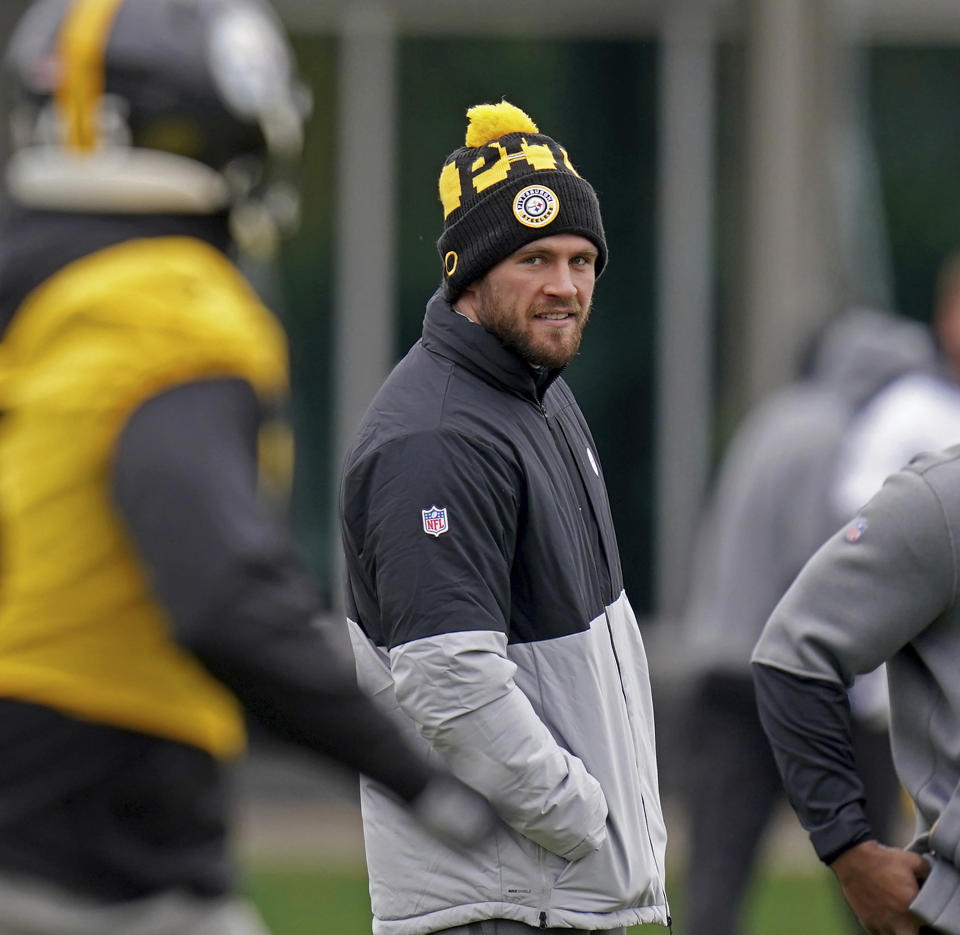 Steelers linebacker T.J. Watt watches from the sideline as his teammates practice during an NFL football practice, Friday, Nov. 19, 2021, in Pittsburgh. (Matt Freed/Pittsburgh Post-Gazette via AP)