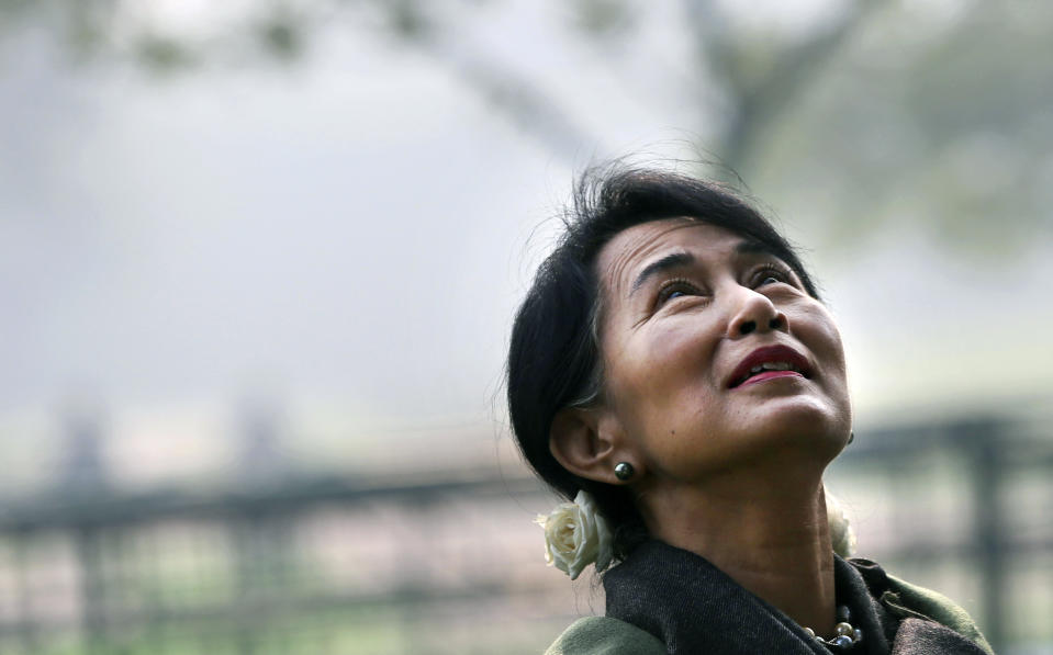 Myanmar's opposition leader and Nobel laureate Aung San Suu Kyi takes a walk after paying tribute at the memorial of India's first Prime Minister Jawaharlal Nehru on his birth anniversary in New Delhi, India, Wednesday, Nov. 14, 2012. Suu Kyi is on a six-day visit to India. (AP Photo/ Manish Swarup)