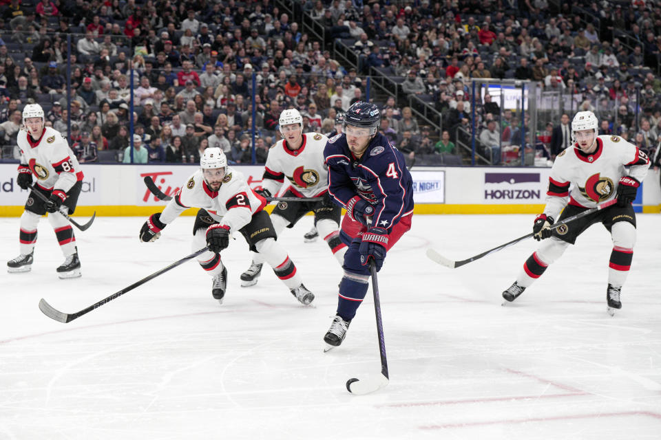 Columbus Blue Jackets' Cole Sillinger (4) looks to shoot against Ottawa Senators defenseman Artem Zub (2) during the second period of an NHL hockey game Thursday, March 14, 2024, in Columbus, Ohio. (AP Photo/Jeff Dean)