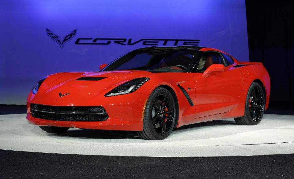 FILE - In this Jan. 14, 2013 file photo, the 2014 Chevrolet Corvette Stingray is revealed at media previews for the North American International Auto Show in Detroit. The new Corvette Stingray has a 455 horsepower, 6.2-liter V-8 engine that can take the car from zero to 60 mph in under four seconds. Yet it can get up to 30 mpg in "Eco" mode with a seven-speed manual transmission. (AP Photo/Paul Sancya, File)