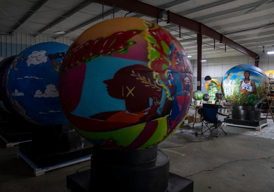 Assorted basketballs made of fiberglass on Tuesday, Jan. 30, 2024, about three weeks before the NBA All-Star Game. A total of 24 sculptures are made by Hoosier artists that depict various elements of hoops-happy Indiana.