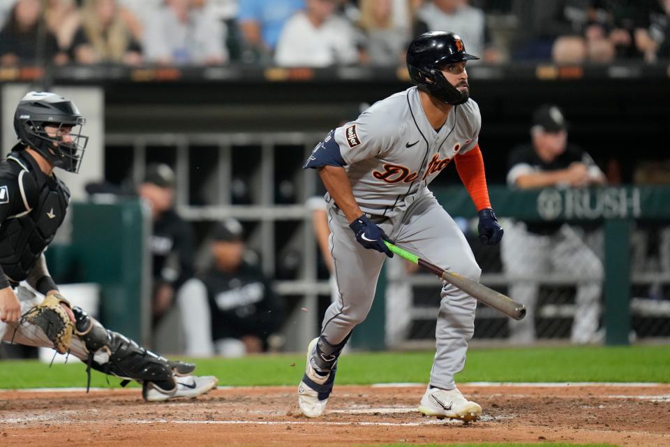 Detroit Tigers' Riley Greene, right, watches his single, which allowed Parker Meadows and Jake Rogers to score, during the fifth inning of a baseball game against the Chicago White Sox, Friday, Sept. 1, 2023, in Chicago. (AP Photo/Erin Hooley)