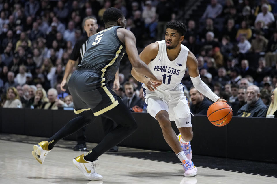 Penn State guard Camren Wynter (11) drives on Purdue guard Brandon Newman (5) during the first half of an NCAA college basketball game in West Lafayette, Ind., Wednesday, Feb. 1, 2023. (AP Photo/Michael Conroy)