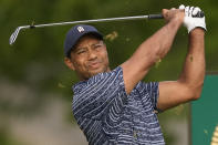 Tiger Woods watches his tee shot on the 11th hole during the first round of the PGA Championship golf tournament, Thursday, May 19, 2022, in Tulsa, Okla. (AP Photo/Matt York)