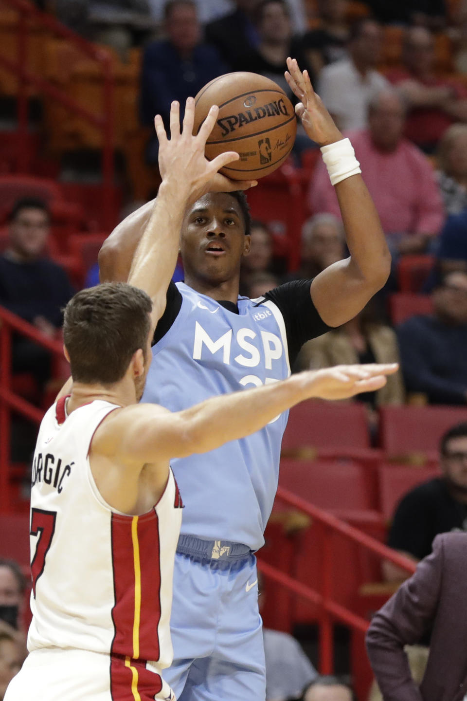 Minnesota Timberwolves guard Jarrett Culver, rear, takes a shot against Miami Heat guard Goran Dragic (7) during the first half of an NBA basketball game, Wednesday, Feb. 26, 2020, in Miami. (AP Photo/Wilfredo Lee)