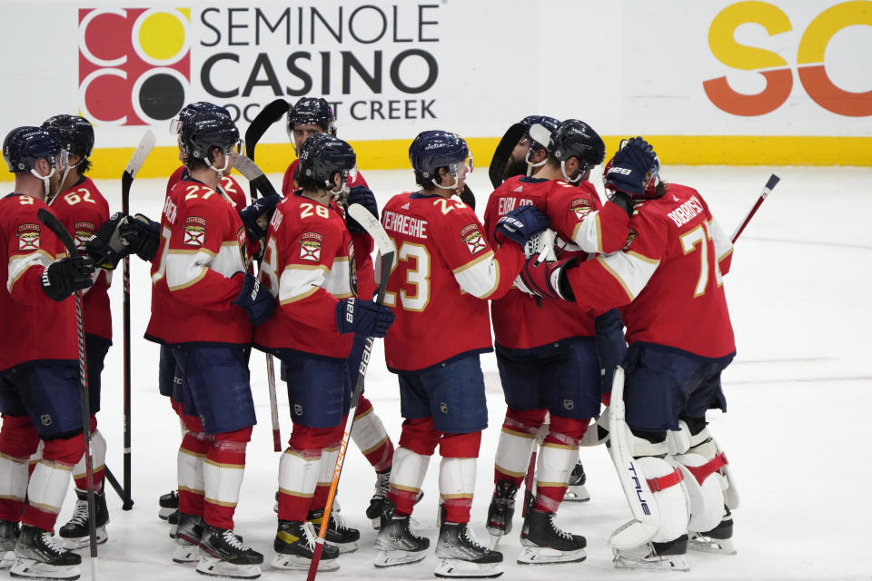 Florida Panthers goaltender Sergei Bobrovsky, far right, is congratulated by teammates after the Panthers beat the San Jose Sharks 4-1 in an NHL hockey game, Thursday, Feb. 9, 2023, in Sunrise, Fla. (AP Photo/Wilfredo Lee)