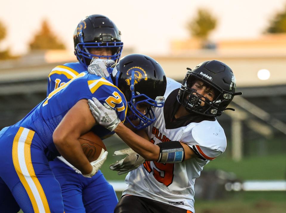 Summerfield’s Brandon Thompson makes a tackle against Adrian Madison last season. Madison has voted to leave the Tri-County Conference.