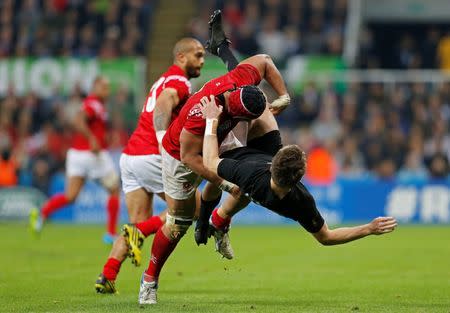 Rugby Union - New Zealand v Tonga - IRB Rugby World Cup 2015 Pool C - St James' Park, Newcastle, England - 9/10/15 New Zealand's Beauden Barrett in action with Tonga's Sione Kalamafoni Action Images via Reuters / Lee Smith