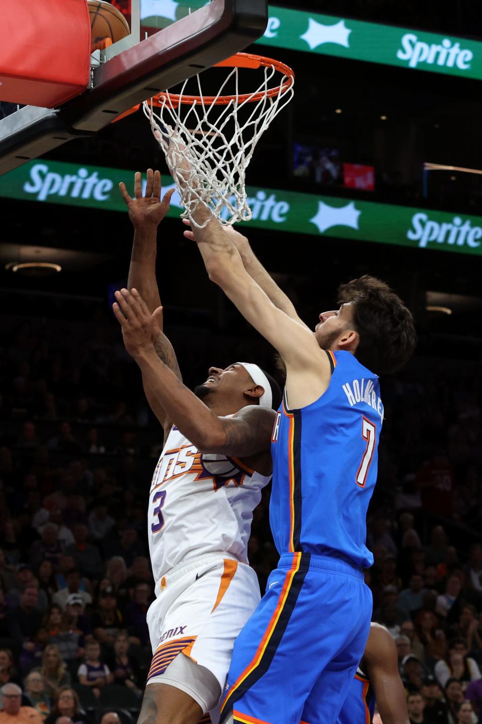 Phoenix Suns guard Bradley Beal (3) makes a basket against Oklahoma City Thunder forward Chet Holmgren (7) during the first quarter at Footprint Center.