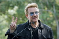 Irish singer Bono speaks to guests before the unveiling of a tapestry honoring John Lennon at Ellis Island in New York July 29, 2015. REUTERS/Eduardo Munoz