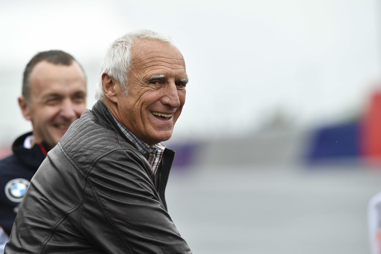 Red Bull founder Dietrich Mateschitz smiles prior to the start of the Formula One Grand Prix, at the Red Bull Ring in racetrack, in Spielberg, Austria, Sunday, July. 3, 2016. (AP Photo/Kerstin Joensson)