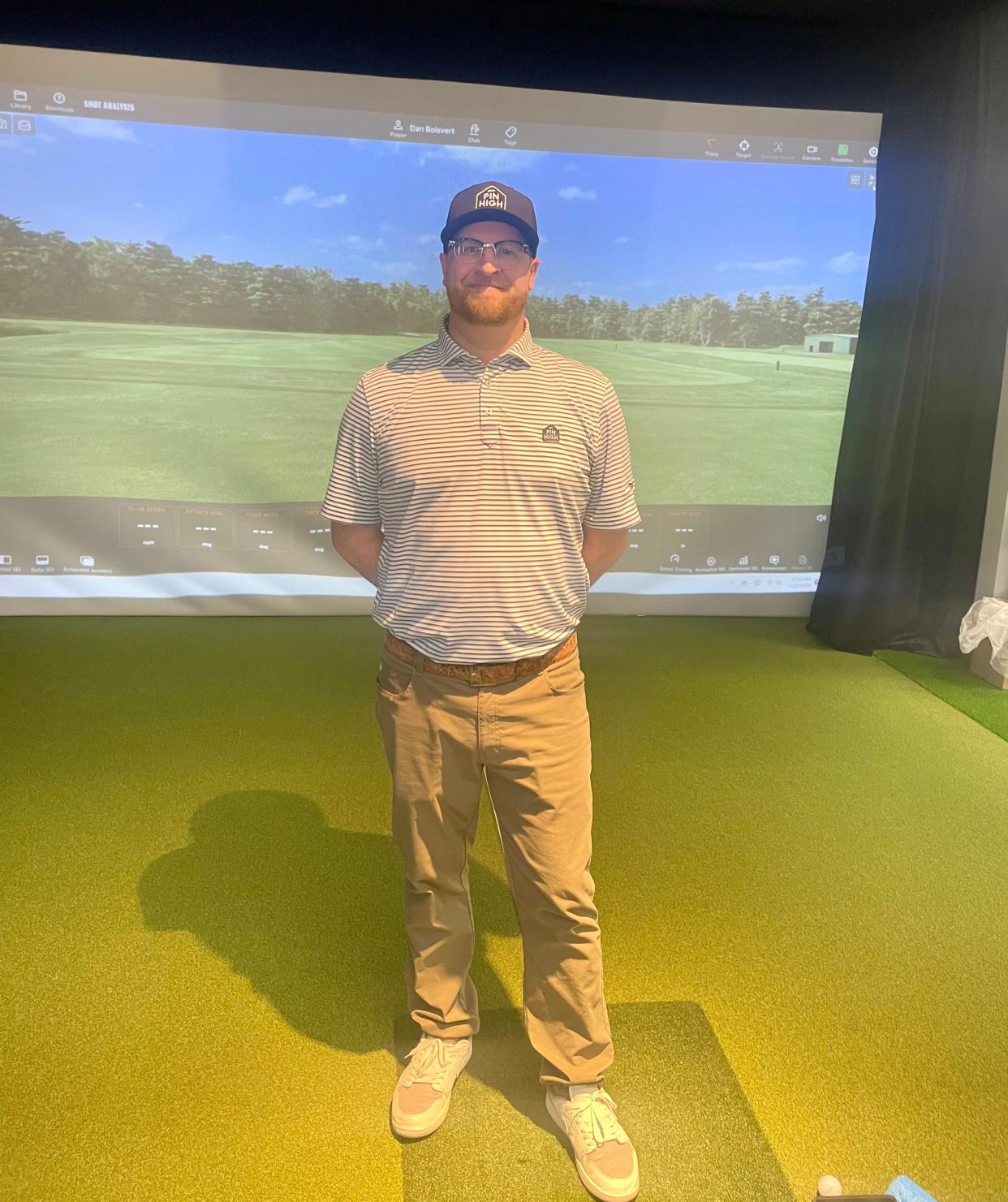 Dan Boisvert stands in front of one of his two Trackman golf simulators at his Pin High Golf center in North Grafton.