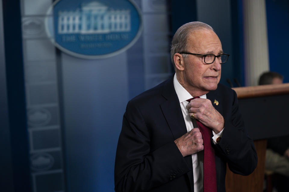 White House chief economic adviser Larry Kudlow adjusts his tie before speaking with reporters about the impact of the Coronavirus on markets in the Brady Press Briefing Room of the White House, Friday, Feb. 28, 2020, in Washington. (AP Photo/Evan Vucci)