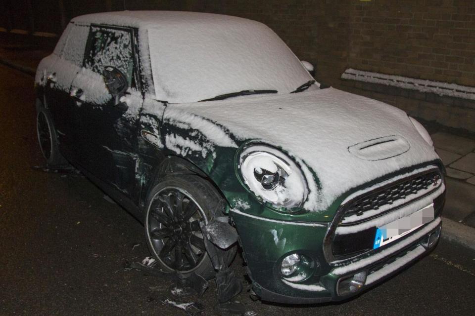 The green mini left by the side of the road after the smash (Splash News)