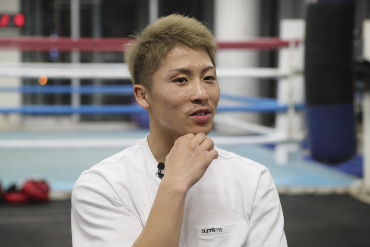 Japanese boxer and the WBA and IBF bantamweight world champion Naoya Inoue speaks during an interview with The Associated Press in Yokohama, near Tokyo on Nov. 23, 2021. Drawing praise as one of the best 