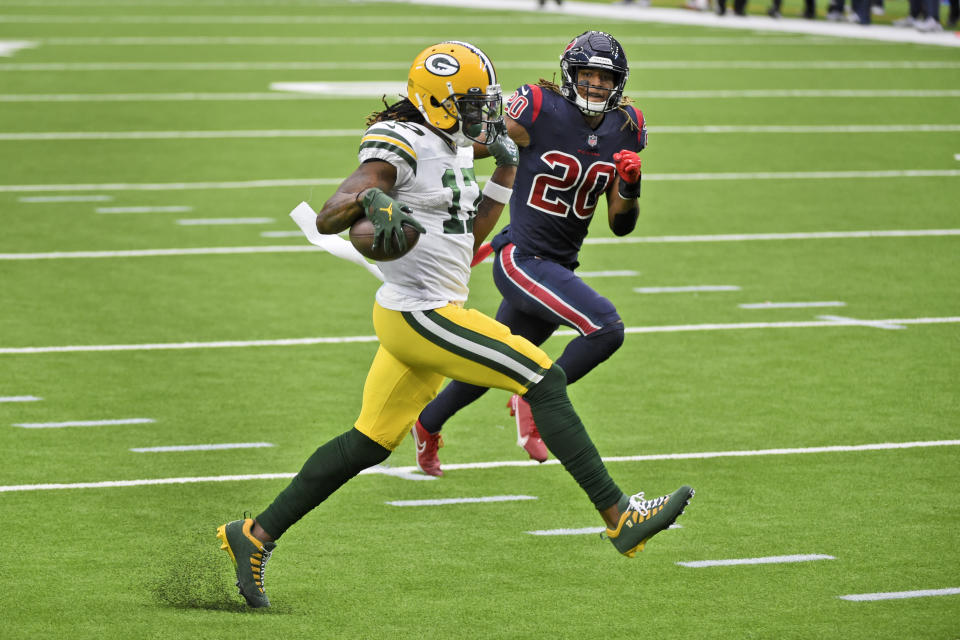 Green Bay Packers wide receiver Davante Adams (17) runs for the end zone past Houston Texans safety Justin Reid (20) after catching a pass for a touchdown during the second half of an NFL football game Sunday, Oct. 25, 2020, in Houston. (AP Photo/Eric Christian Smith)