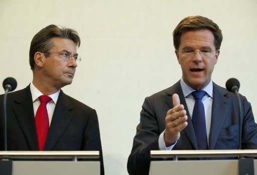 Dutch Prime Minister Mark Rutte (R) and Deputy Prime Minister Maxime Verhagen give a joint press conference in The Hague. The Netherlands is headed for early elections after coalition talks on a fiscal austerity package broke down Saturday, Rutte said