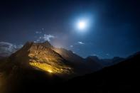 The mountain chains of Veisivi and Dent de Perroc are illuminated to celebrate Swiss National Day in Evolene