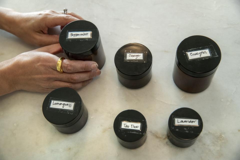 Small jars labeled with different scents