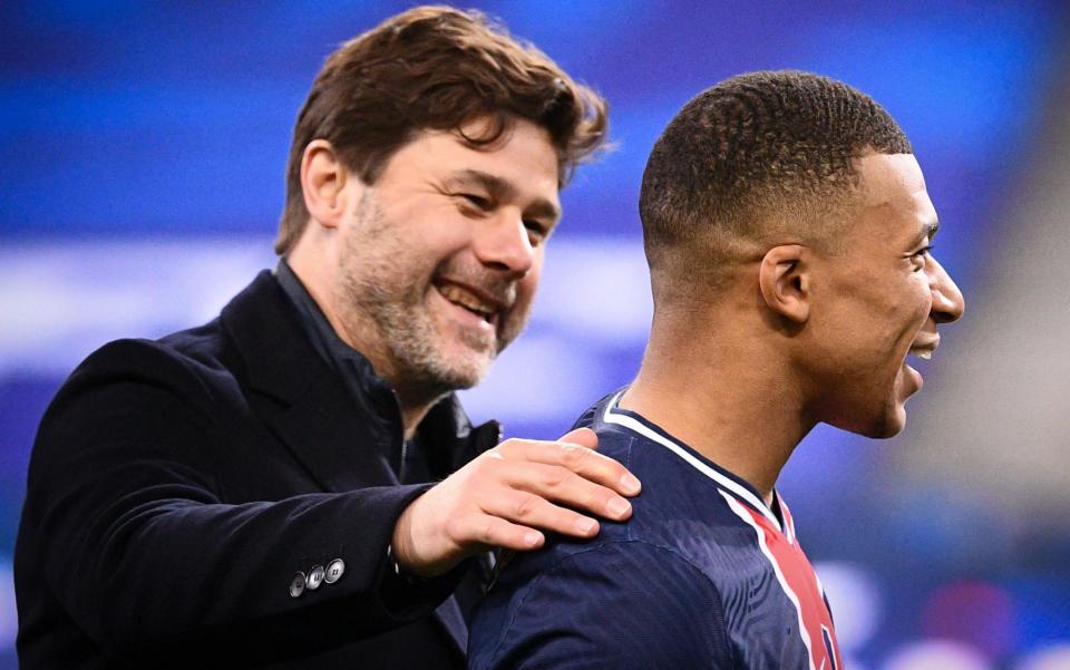 Mauricio Pochettino embraces Kylian Mbappe - AFP