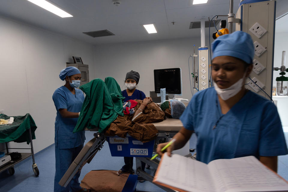 Nurses with a patient after an IVF procedure at the Akanksha Hospital. If the procedure succeeds, the surrogate will stay at the hospital for her entire pregnancy.<span class="copyright">Smita Sharma for TIME</span>