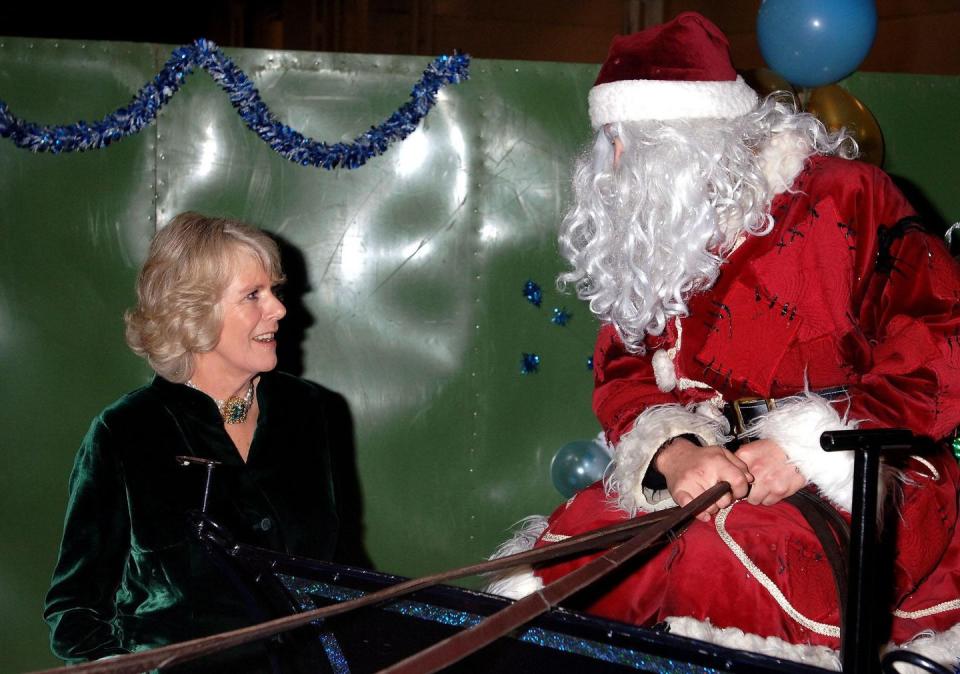 <p>Duchess Camilla chats with Santa while in a horse drawn sleigh, backstage at the London International Horse Show.</p>