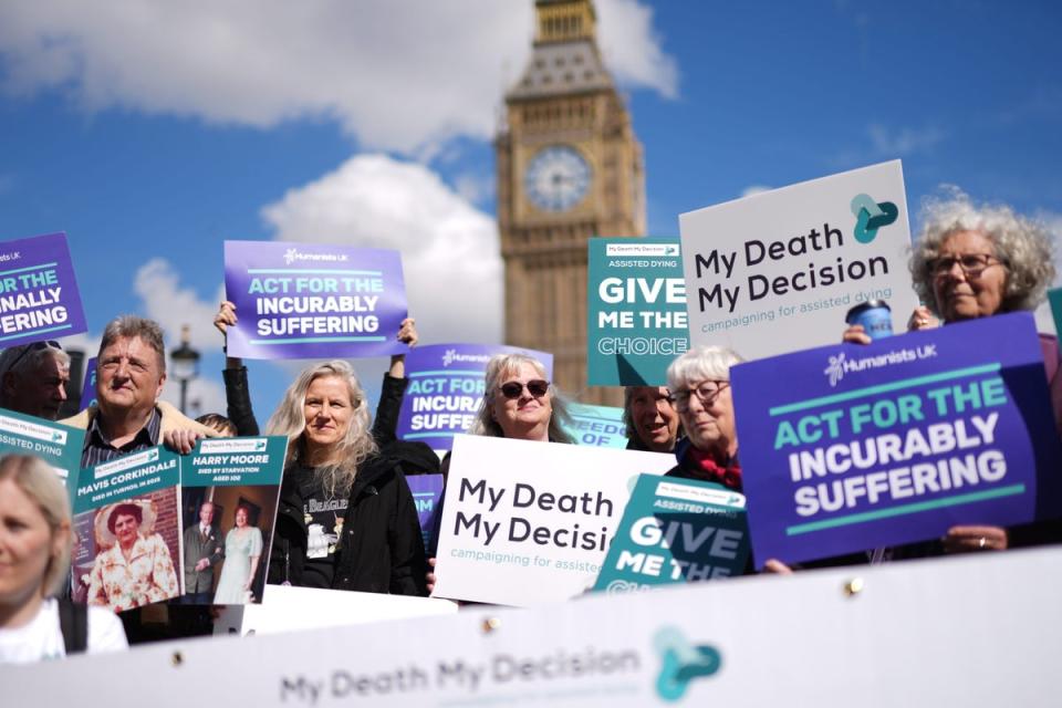 Campaigners gathered outside parliament as a debate on assisted dying began (Jordan Pettitt/PA) (PA Wire)