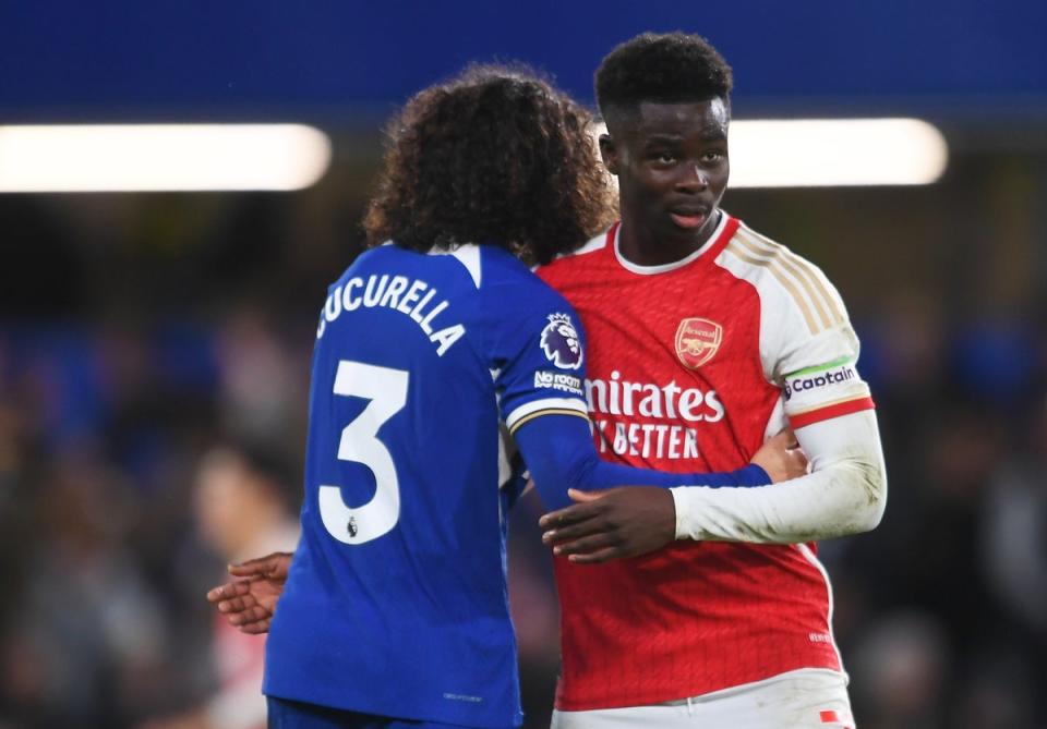 No love lost: Marc Cucurella and Bukayo Saka have had some memorable battles in the Premier League (Arsenal FC via Getty Images)