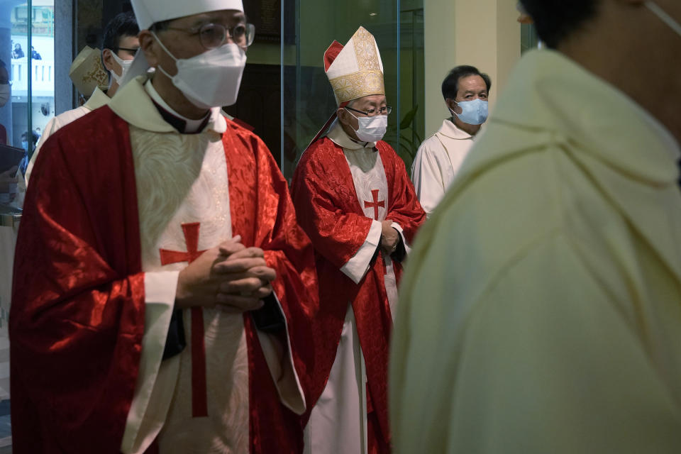 Retired archbishop of Hong Kong Joseph Zen, center, attends the episcopal ordination ceremony of Bishop Stephen Chow, in Hong Kong, Saturday, Dec. 4, 2021. Zen, the 90-year-old Catholic cleric arrested by Hong Kong police on national security charges, has long been a fiery critic of Beijing, along with efforts by the Vatican to reach a working arrangement with the ruling Communist Party. (AP Photo/Kin Cheung)