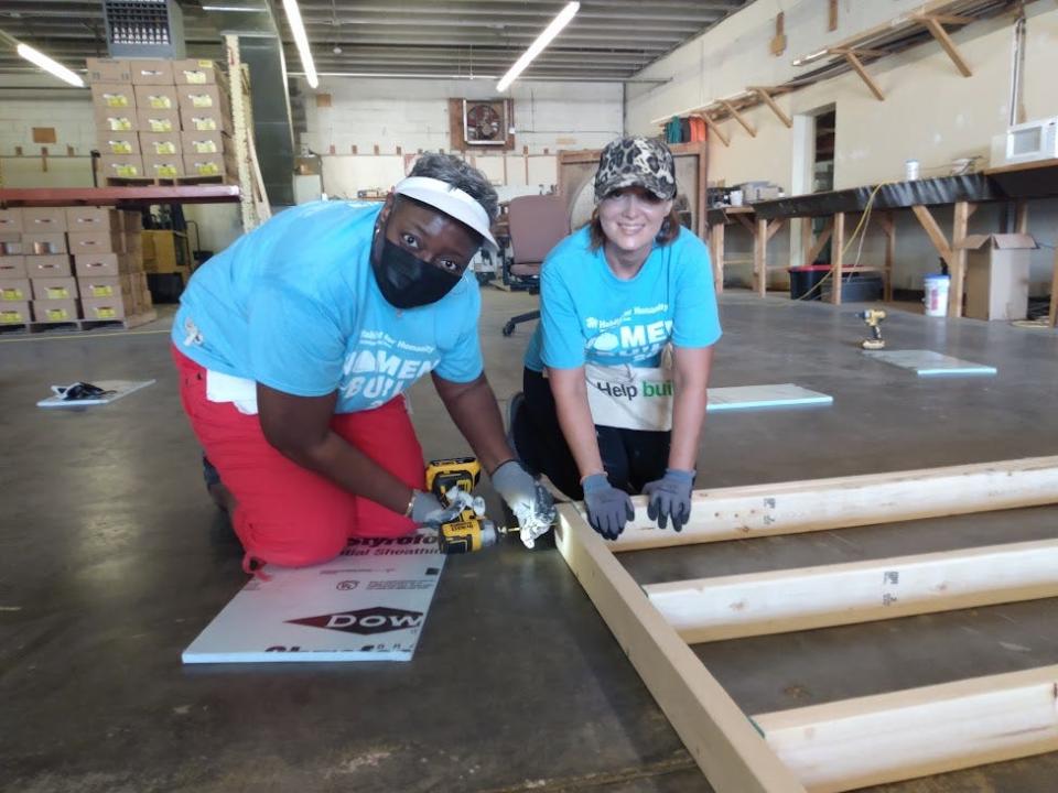 Habitat volunteers Miranda Longino of Jackson and Kathy Thornton of Florence practice their homebuilding skills.