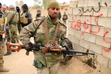 Lions of The Tigris a group of Sunni Arab fighters part of the The Popular Mobilisation Committee, or Hashid Shaabi take part during a military operation against Islamic State militants in Shayyalah al-Imam, Iraq November 30, 2016. REUTERS/Thaier Al-Sudani