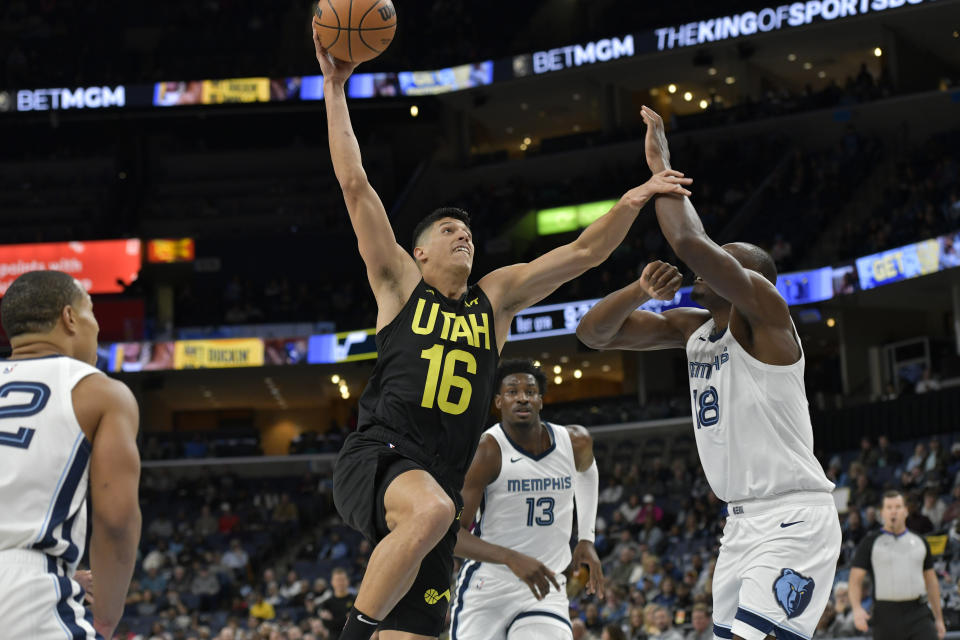 Utah Jazz forward Simone Fontecchio (16) shoots against Memphis Grizzlies center Bismack Biyombo (18) in the first half of an NBA basketball game Wednesday, Nov. 29, 2023, in Memphis, Tenn. (AP Photo/Brandon Dill)