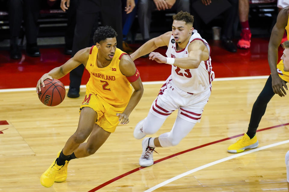 Maryland's Aaron Wiggins (2) drives around Wisconsin's Kobe King (23) during the first half of an NCAA college basketball game Tuesday, Jan. 14, 2020, in Madison, Wis. (AP Photo/Andy Manis)