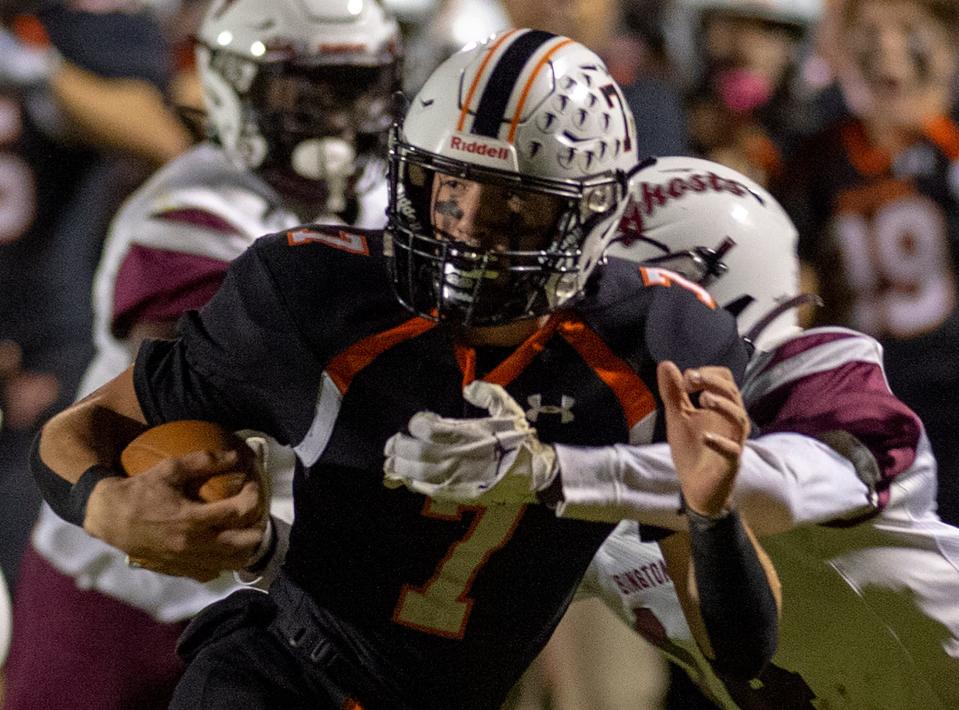 Pennsbury’s Nathan Beighley gains yardage, in the first quarter, during the Friday night high school football game between Pennsbury and Abington held at Pennsbury High School’s new stadium, Friday, Oct. 21, 2022.