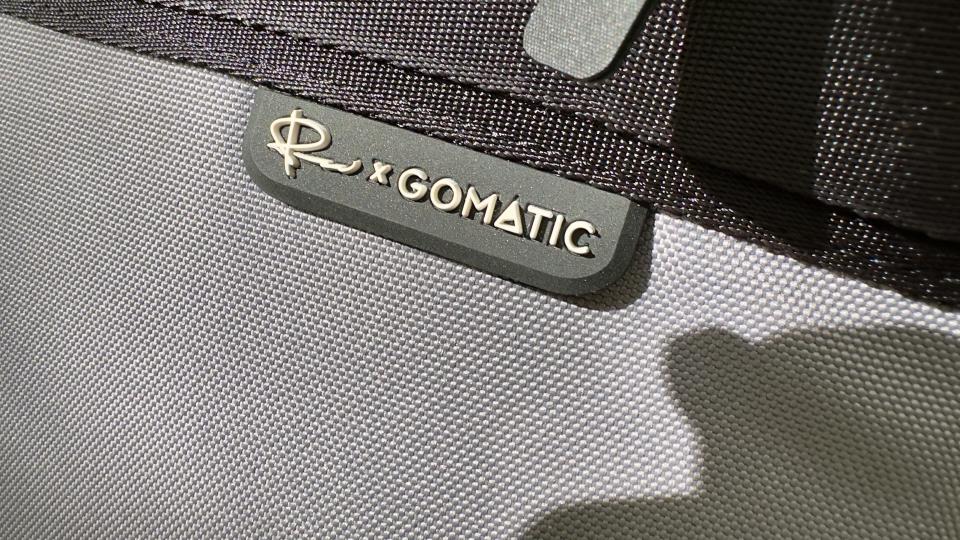 Close up of the logo on a Nomatic LUMA Camera Sling