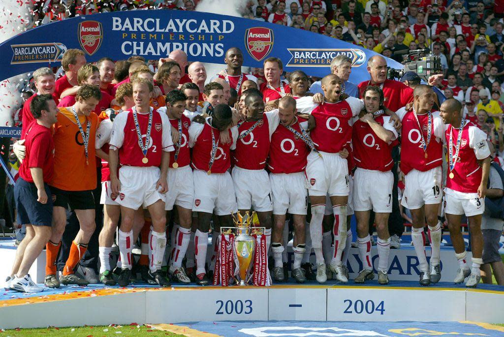 Arsenal players celebrate winning the 2003-04 Premier League