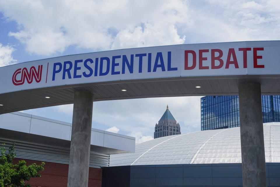 Signs promoting the debate between U.S. President Joe Biden and his rival Donald Trump are erected around the venue at CNN Center in Atlanta, Georgia on June 24, 2024.